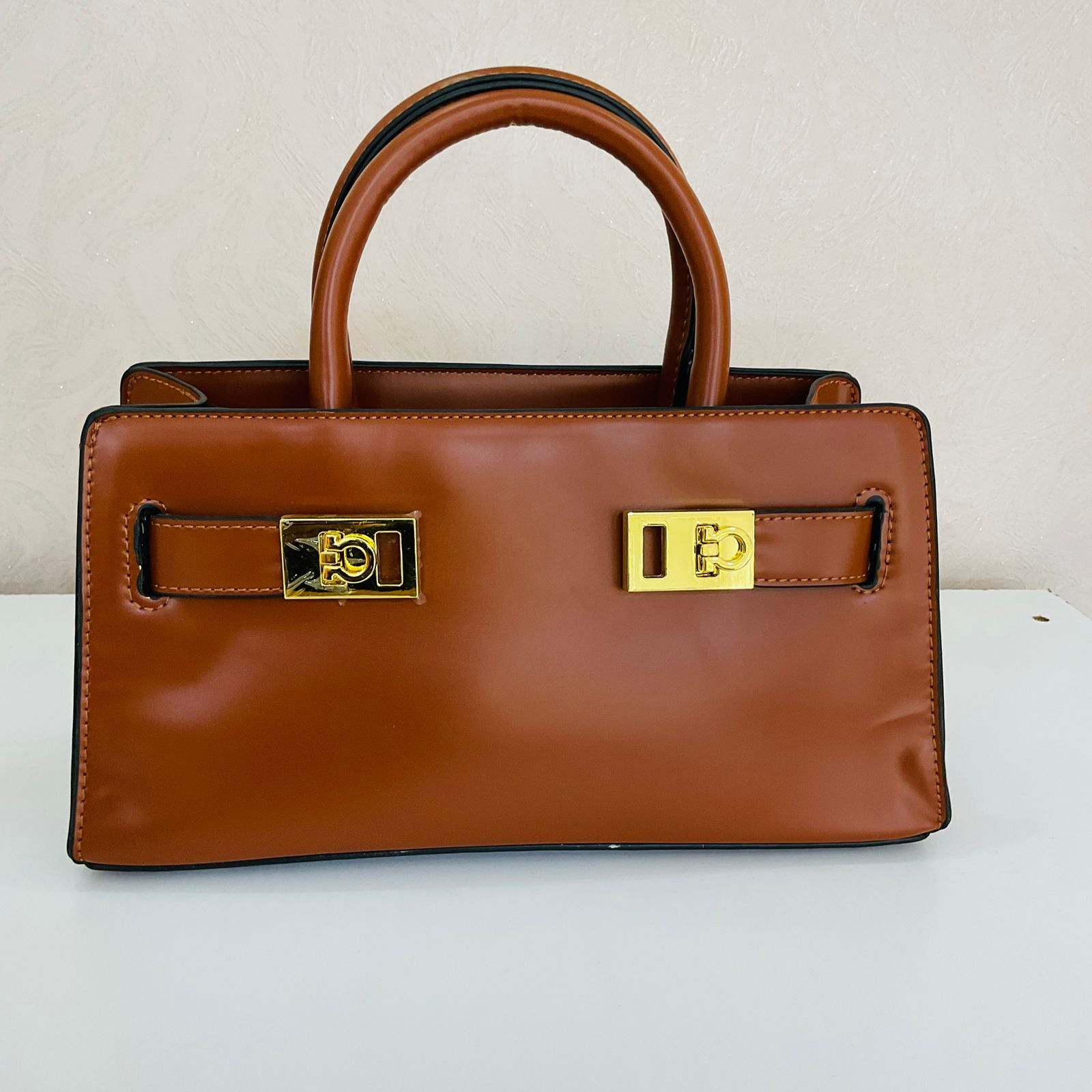 BROWN LEATHER BAG- GOLDEN HANDLES